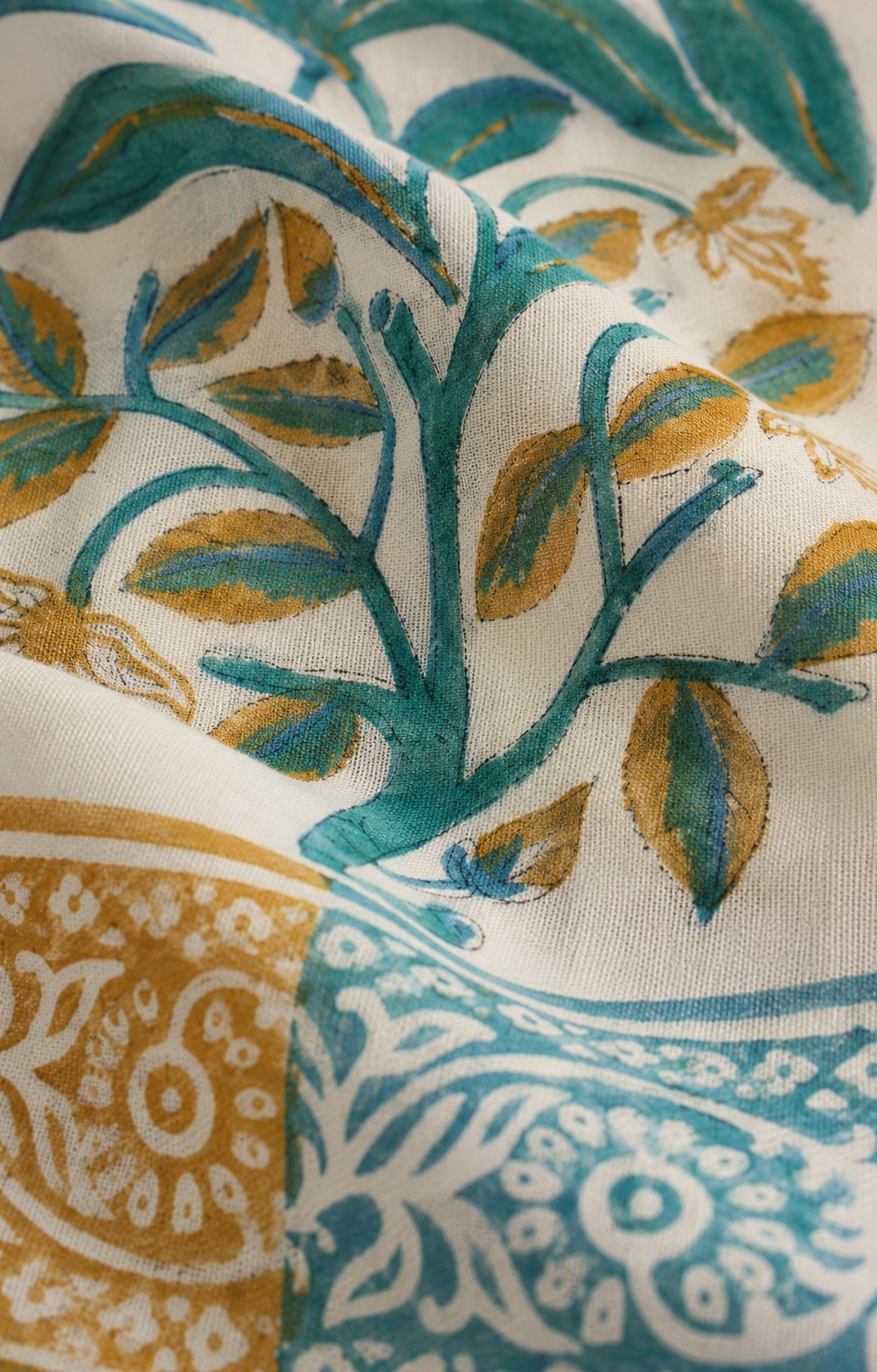 Close-up of hand block printed fabric showing slight variation in colour and print edges