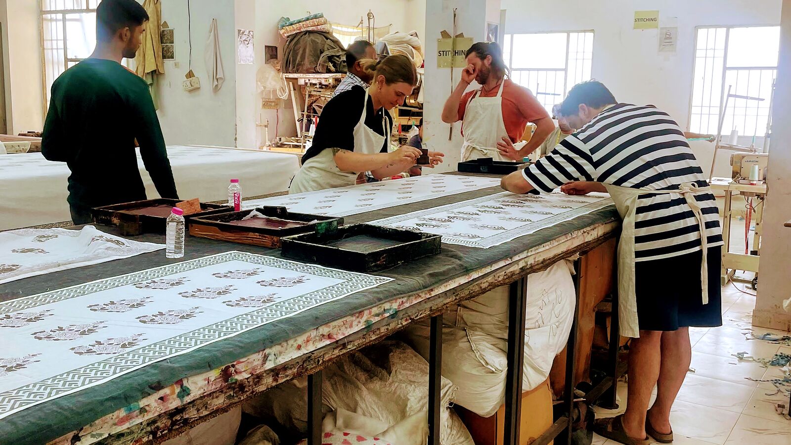 A freshly printed block print sample laid out on a printing table